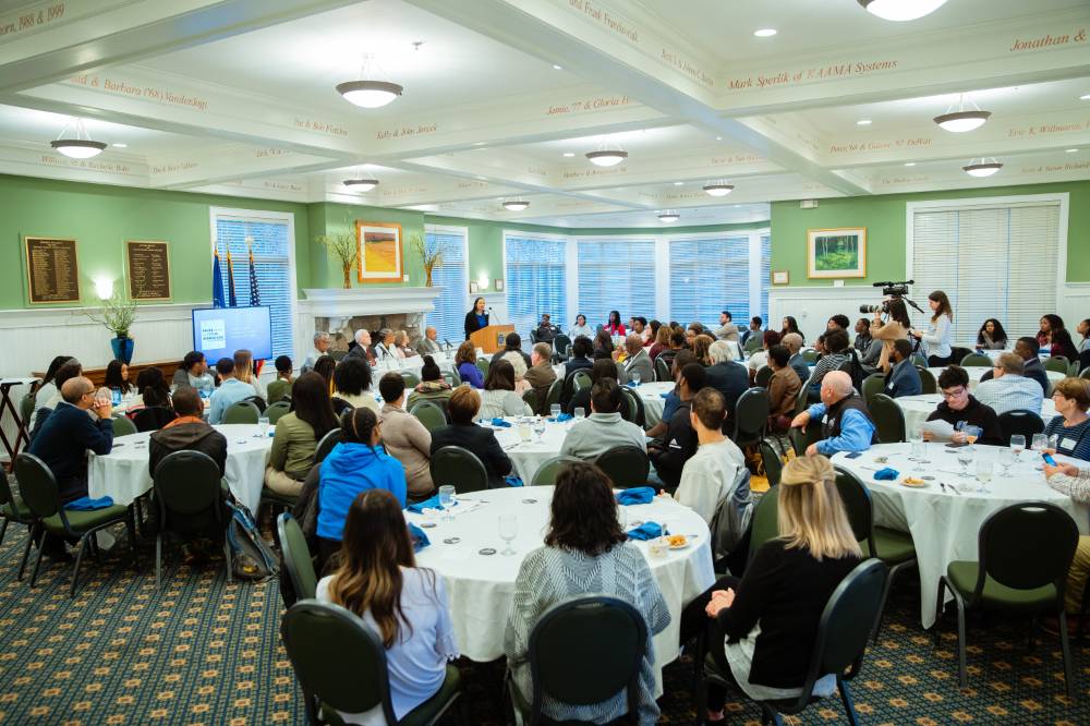 Guests listen to speaker at Pave the Way
